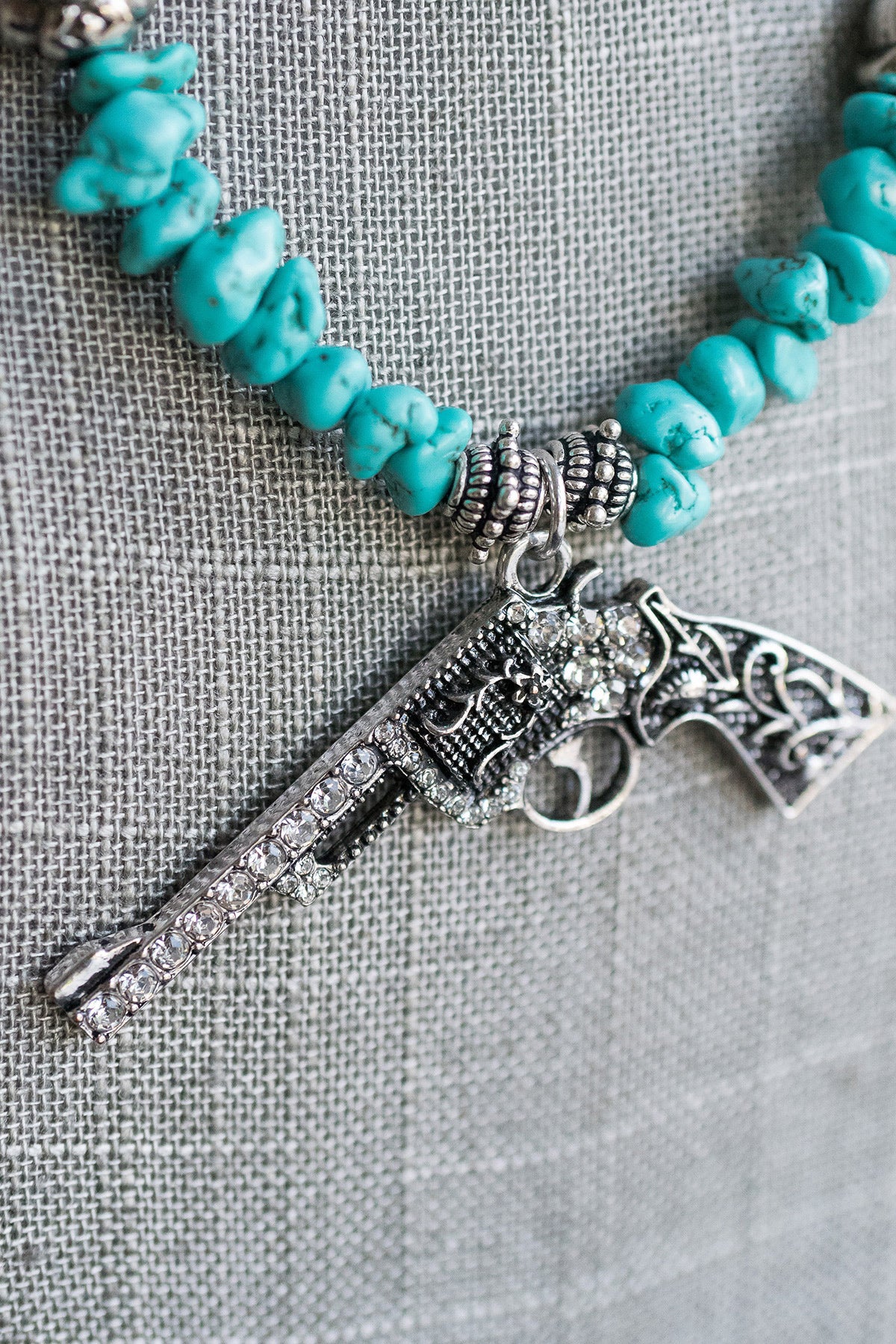 Turquoise Beaded Necklace with Rhinestone Pistol Pendant